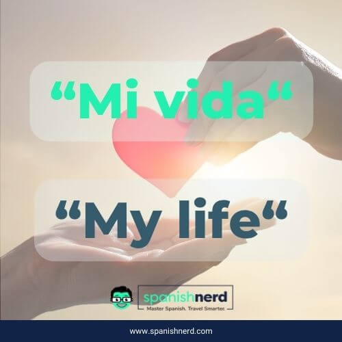 A spanish I love you phrase that says mi vida meaning M y life in English to signify the importance of someone to you with a hand handing a paper hear to anotherh and